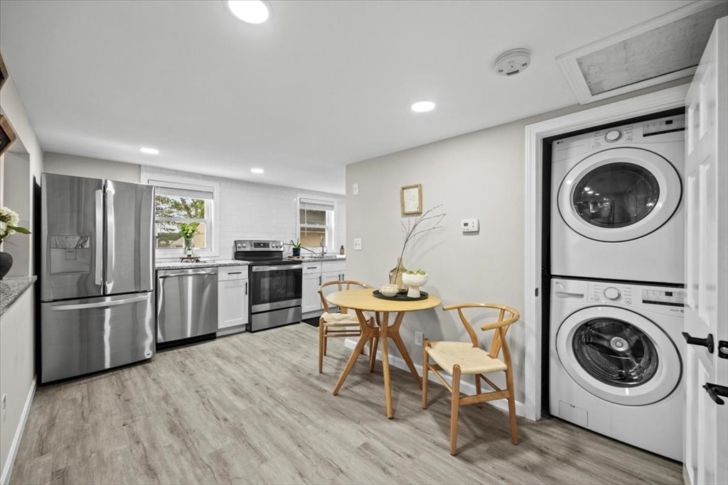14 Pinehurst Drive Wareham, MA 02571 - Photo 18 of 41 a kitchen with stainless steel appliances a refrigerator a stove top oven a sink and cabinets