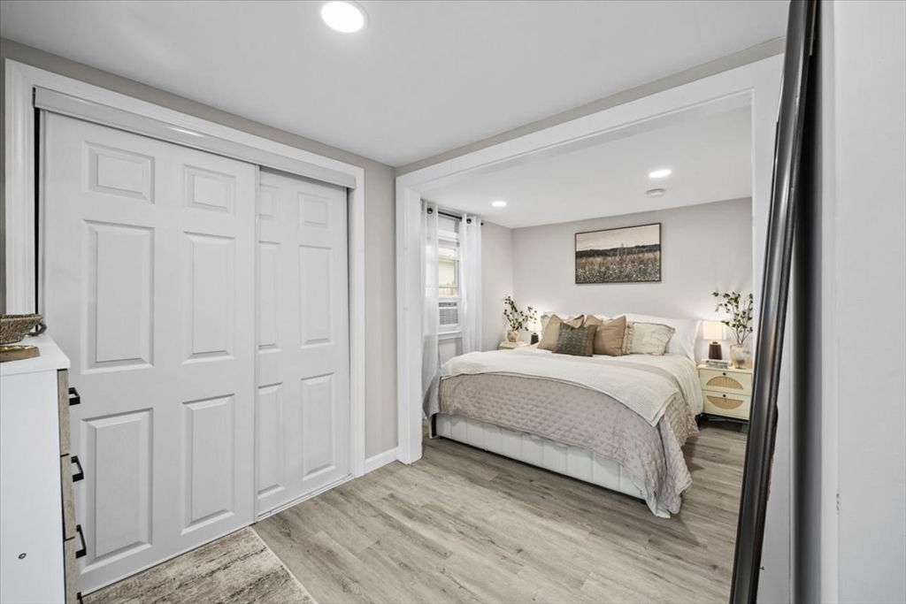 14 Pinehurst Drive Wareham, MA 02571 - Photo 24 of 41 a white bed sitting in a bedroom next to a cabinet