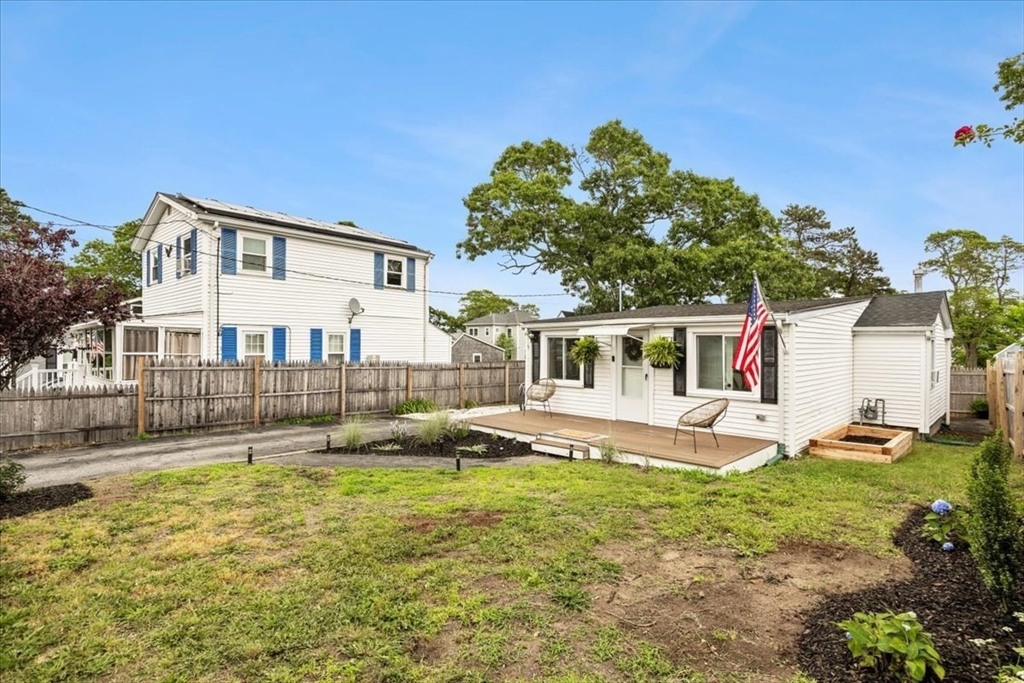14 Pinehurst Drive Wareham, MA 02571 - Photo 27 of 41 a front view of a house with a yard table and chairs