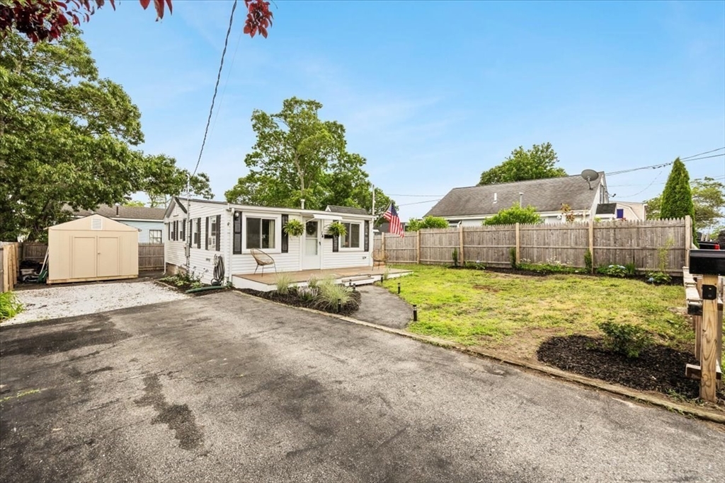 14 Pinehurst Drive Wareham, MA 02571 - Photo 31 of 41 a view of a house with a yard and fence