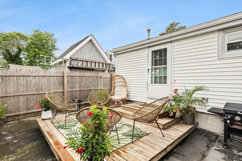 14 Pinehurst Drive Wareham, MA 02571 - Photo 34 of 41 a view of a chairs and tables in the back yard of the house