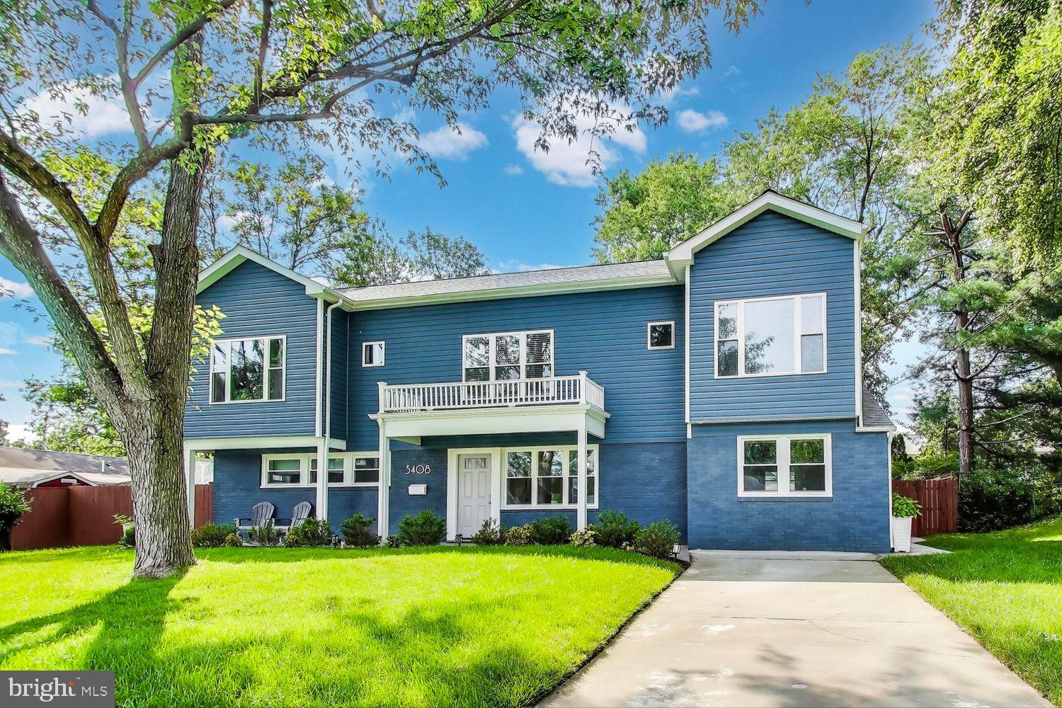 a view of house with yard