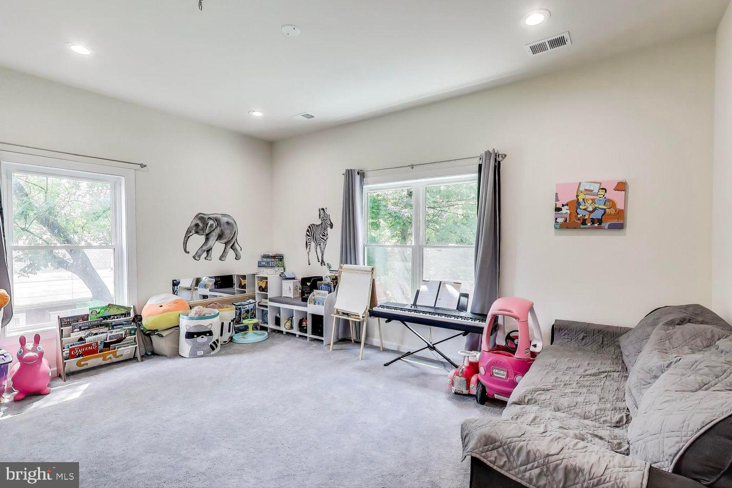 5408 Danville Street Springfield, VA 22151 - Photo 15 of 29 a living room with furniture toys and a large window