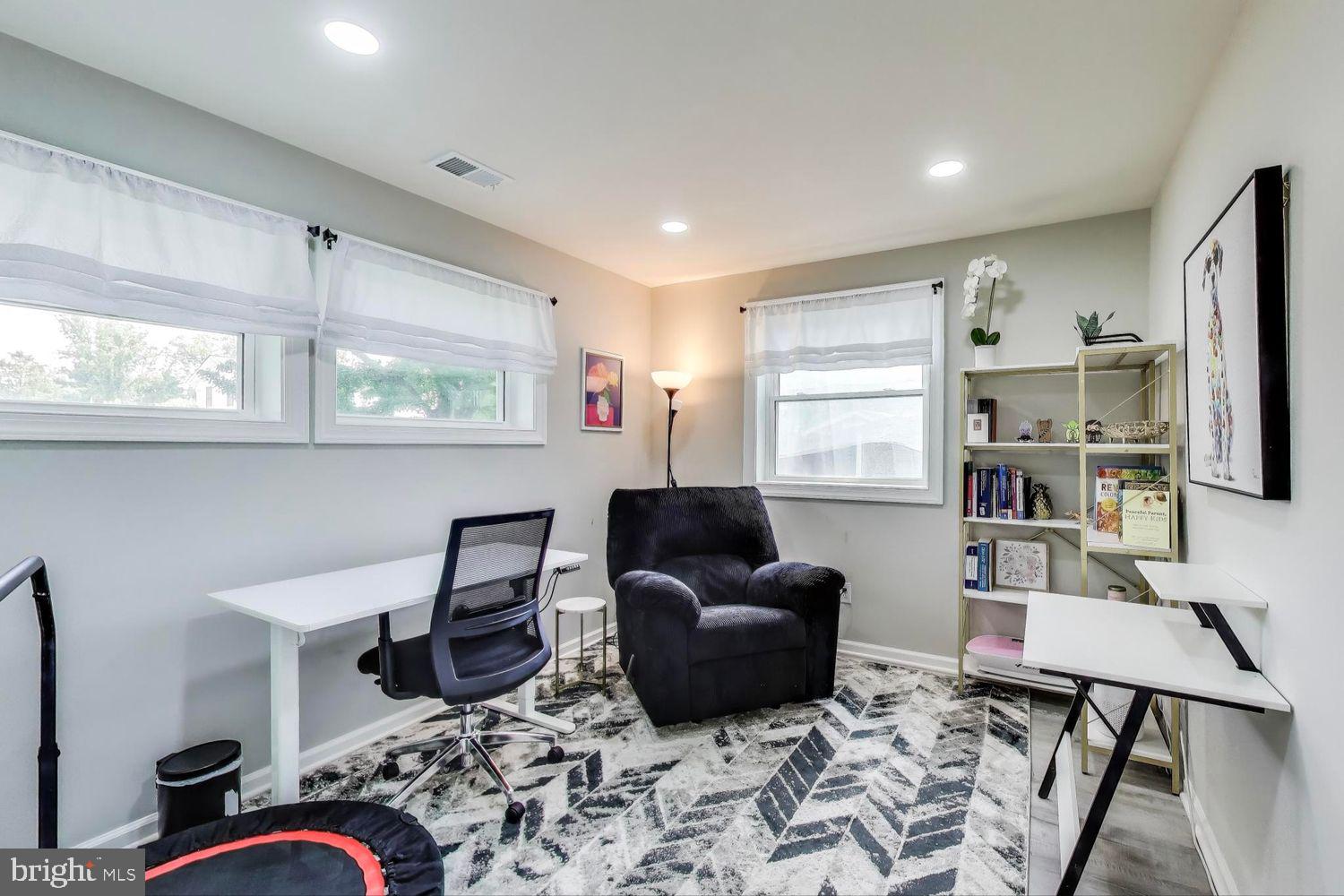 5408 Danville Street Springfield, VA 22151 - Photo 20 of 29 a living room with furniture a flat screen tv and a window