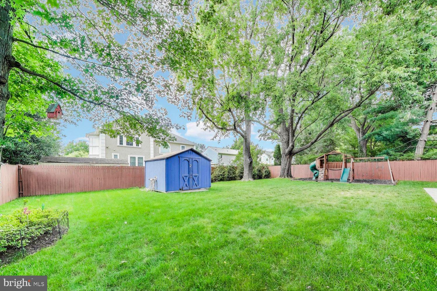 5408 Danville Street Springfield, VA 22151 - Photo 26 of 29 a view of a garden with large trees