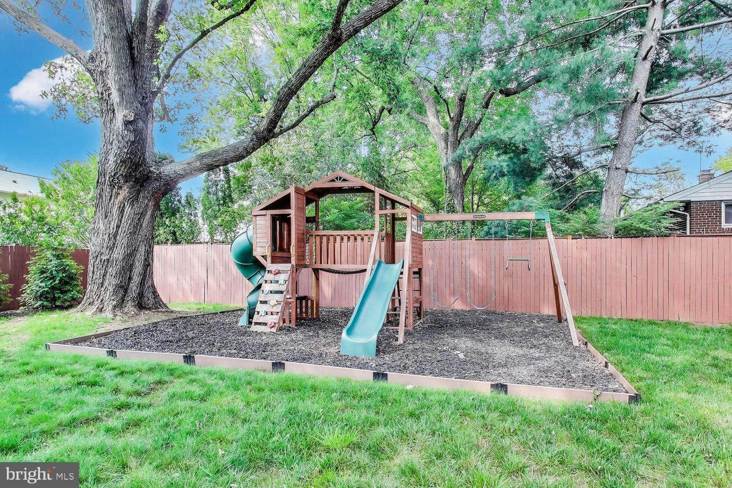 5408 Danville Street Springfield, VA 22151 - Photo 27 of 29 a view of a backyard with a slide