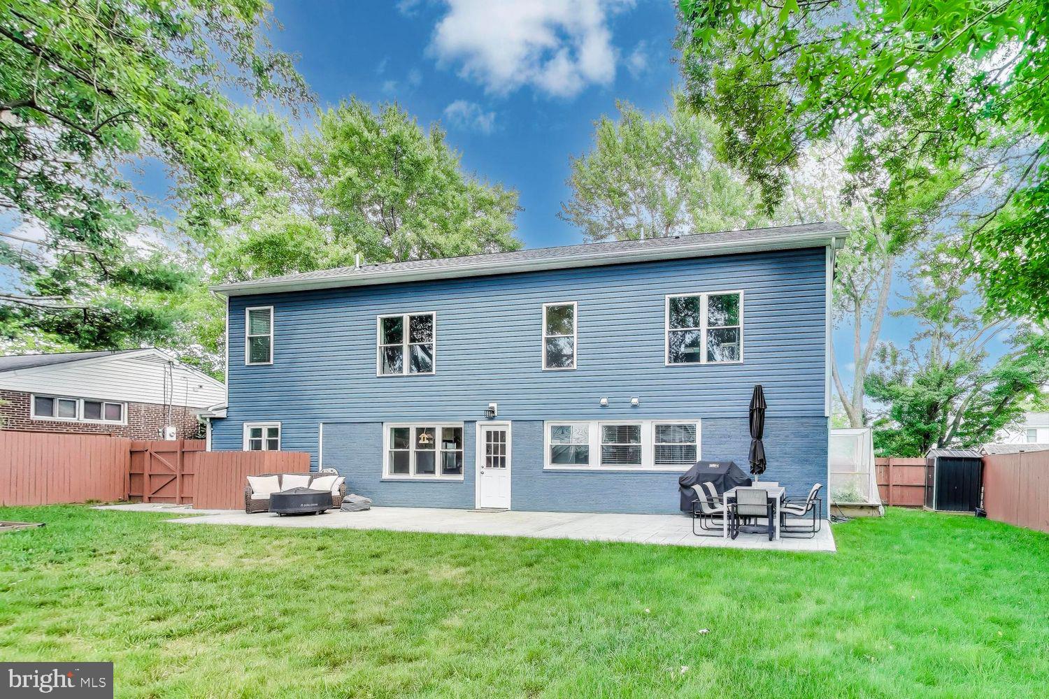 5408 Danville Street Springfield, VA 22151 - Photo 28 of 29 a view of a house with a yard and sitting area