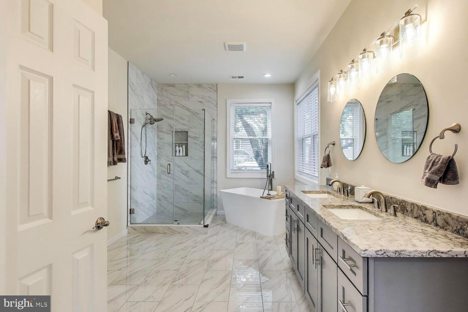 5408 Danville Street Springfield, VA 22151 - Photo 7 of 29 a spacious bathroom with a granite countertop double vanity sink mirror and shower