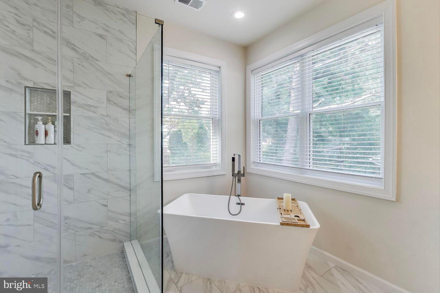 5408 Danville Street Springfield, VA 22151 - Photo 8 of 29 a bathroom with a bathtub and shower