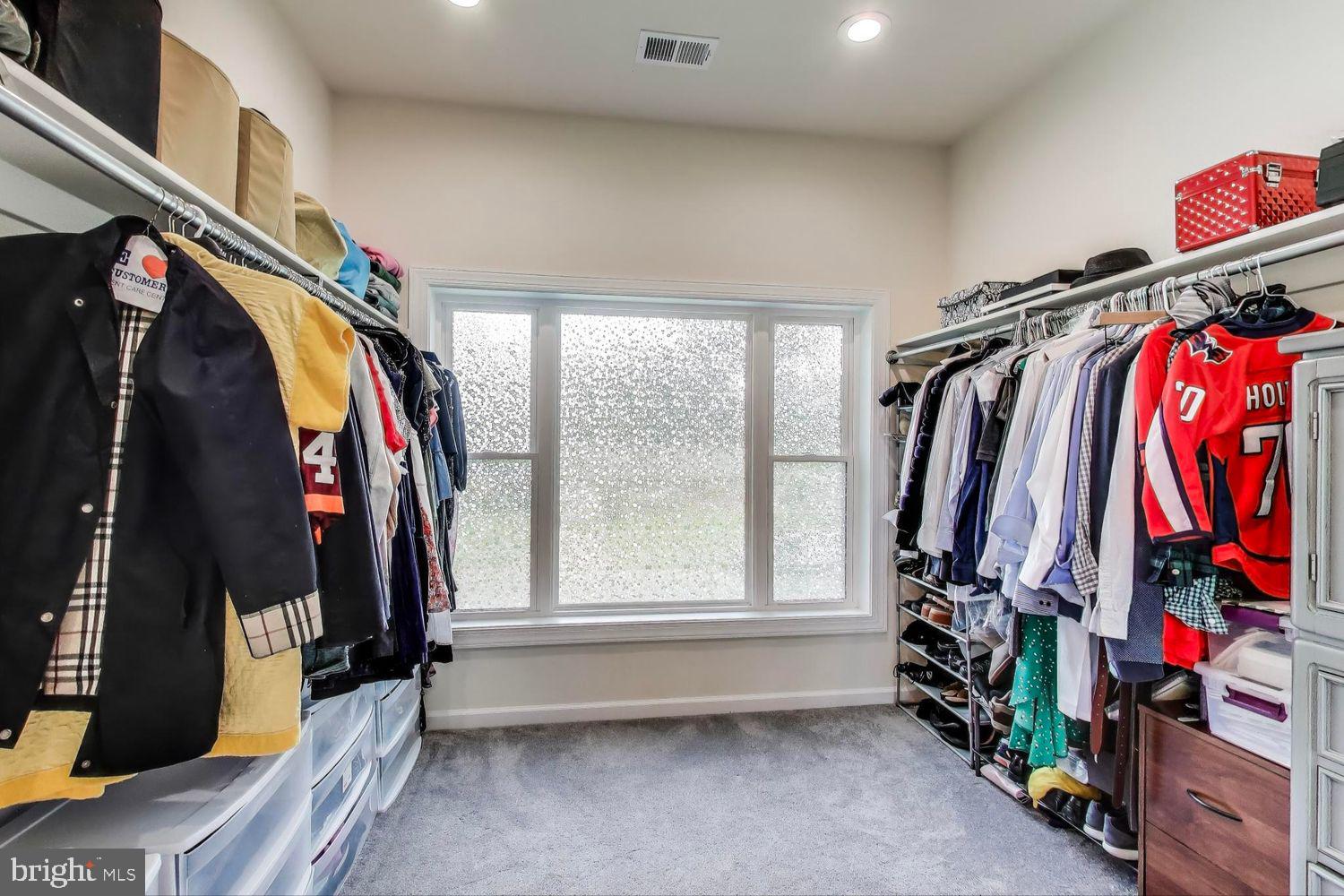 5408 Danville Street Springfield, VA 22151 - Photo 9 of 29 a view of walk in closet with clothes and shoes