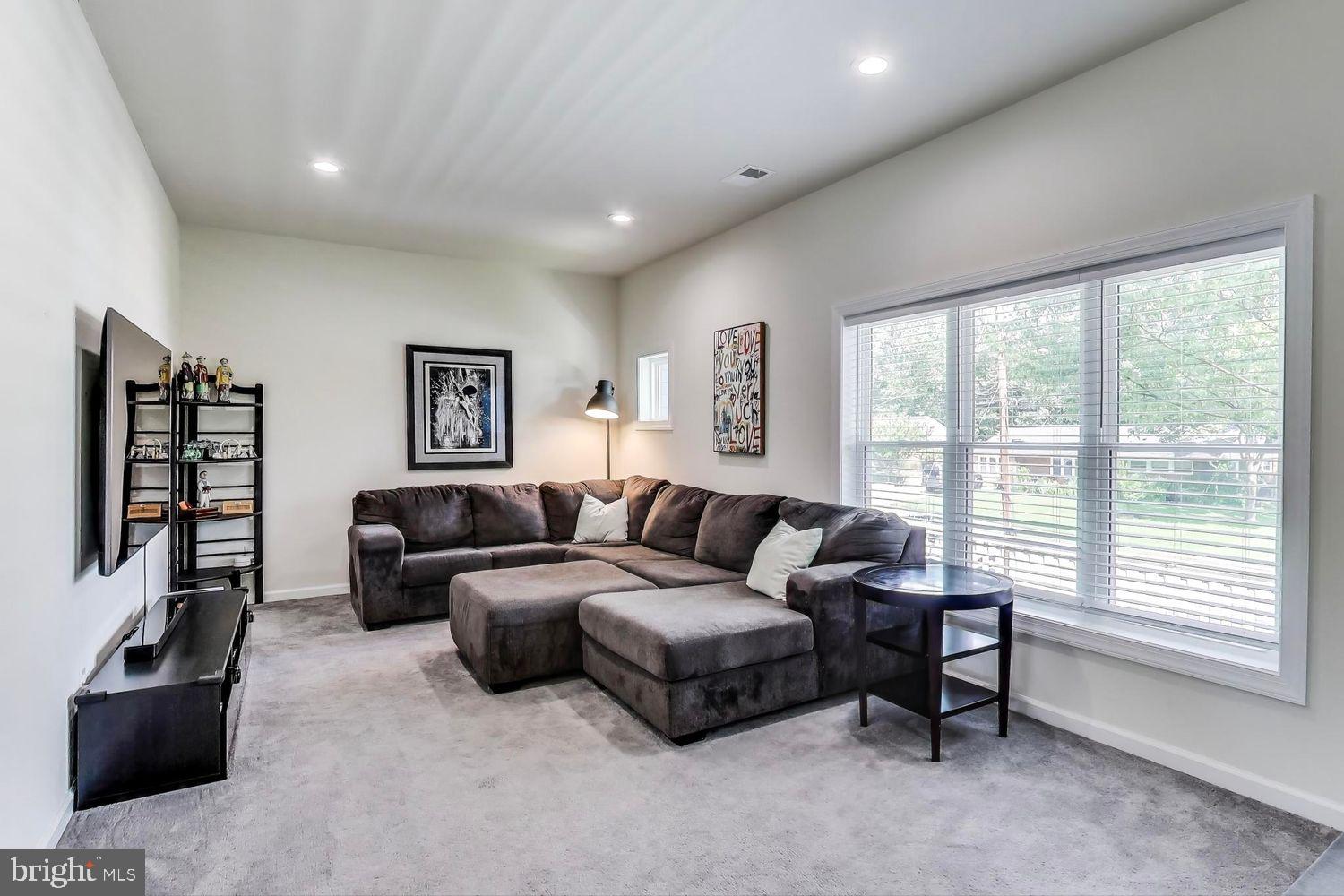 5408 Danville Street Springfield, VA 22151 - Photo 10 of 29 a living room with furniture and a flat screen tv