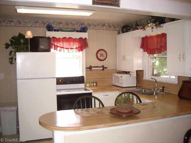 219 Model Farm Road High Point, NC 27263 - Photo 5 of 9 Other. The kitchen features a built in breakfast bar! Note that all of the appliances stay with the house...even the washer and dryer!