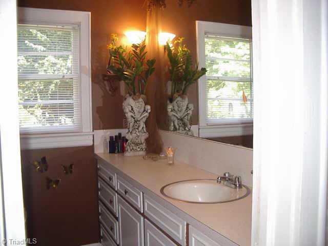 219 Model Farm Road High Point, NC 27263 - Photo 8 of 9 Other. The bathroom looks like a page out of a home design magazine!