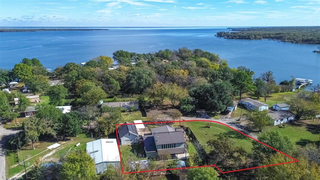 an aerial view of a city and lake view