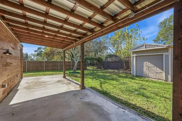 a view of backyard with green space