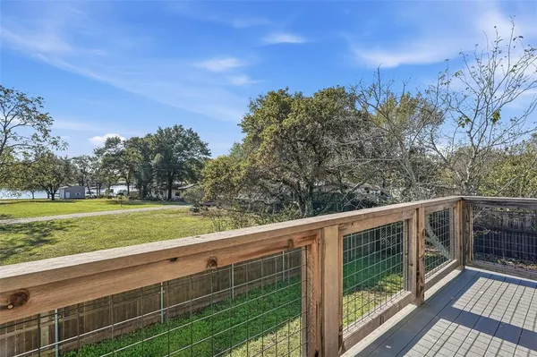 a view of outdoor space with deck and yard