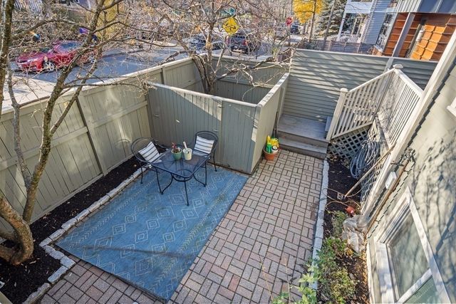 swimming pool view with a seating space