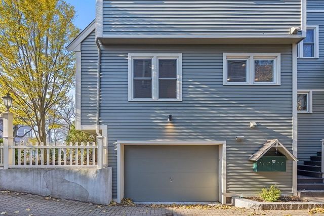 a view of brick house with large windows