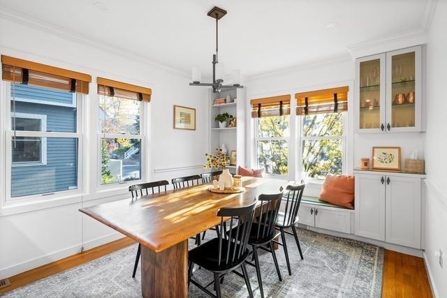 a dining room with furniture and window