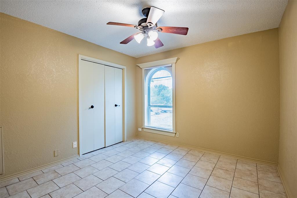 805 North Fielder Road Arlington, TX 76012 - Photo 11 of 17 a view of an empty room with a window