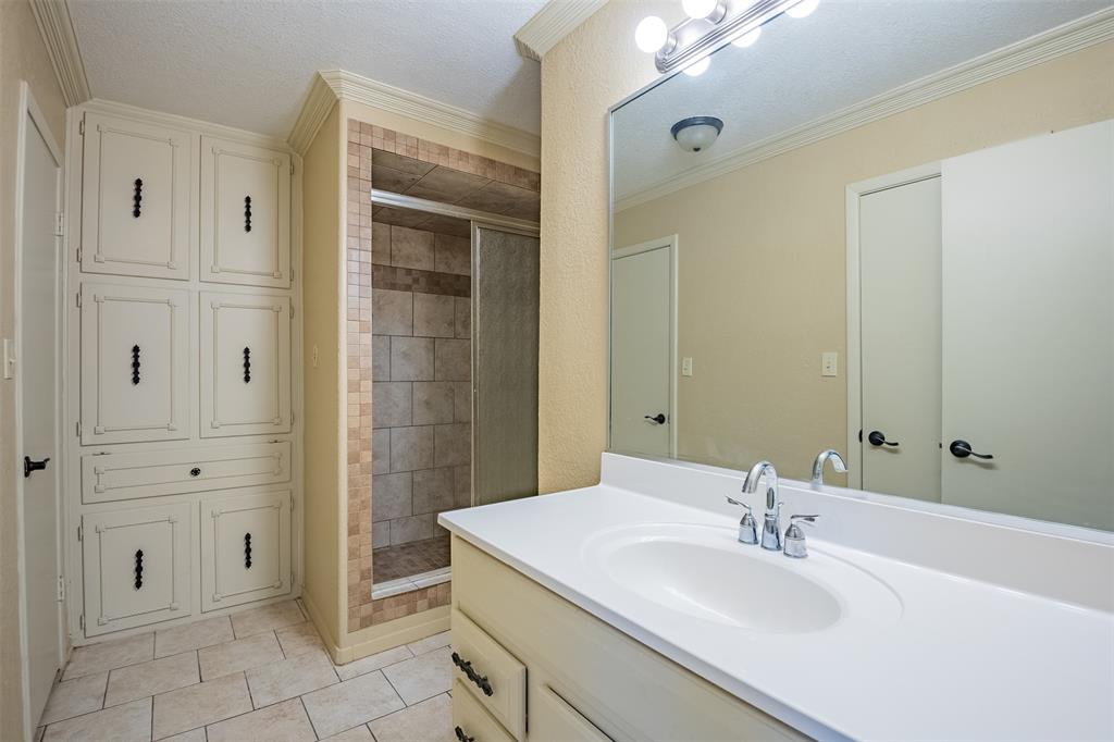 805 North Fielder Road Arlington, TX 76012 - Photo 15 of 17 a bathroom with a sink and a mirror