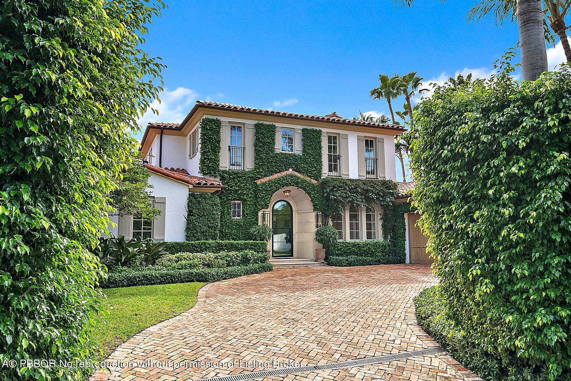 234 Ridgeview Drive Palm Beach, FL 33480 - Photo 2 of 20 a front view of a house with a yard