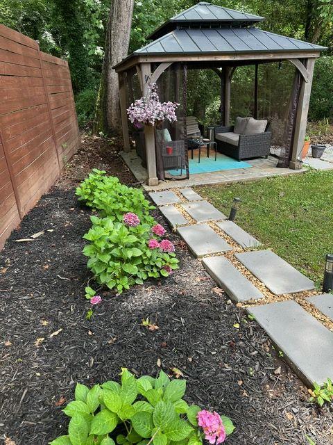 2434 Rockcliff Road Southeast Atlanta, GA 30316 - Photo 13 of 13 a view of a patio with table and chairs potted plants