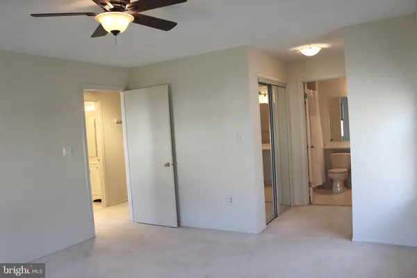 a view of an empty room with a bathroom