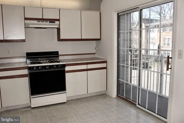 a kitchen with a stove and a microwave