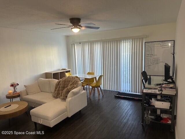 223 Columbia Drive, Unit 114 Cape Canaveral, FL 32920 - Photo 2 of 14 a living room with furniture and wooden floor