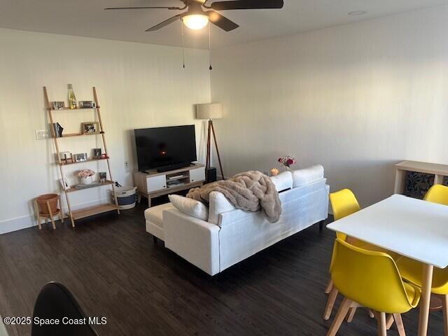 223 Columbia Drive, Unit 114 Cape Canaveral, FL 32920 - Photo 3 of 14 a living room with furniture and a flat screen tv