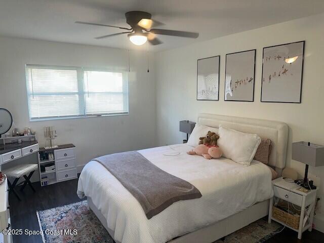 223 Columbia Drive, Unit 114 Cape Canaveral, FL 32920 - Photo 6 of 14 a bedroom with a large bed and a window