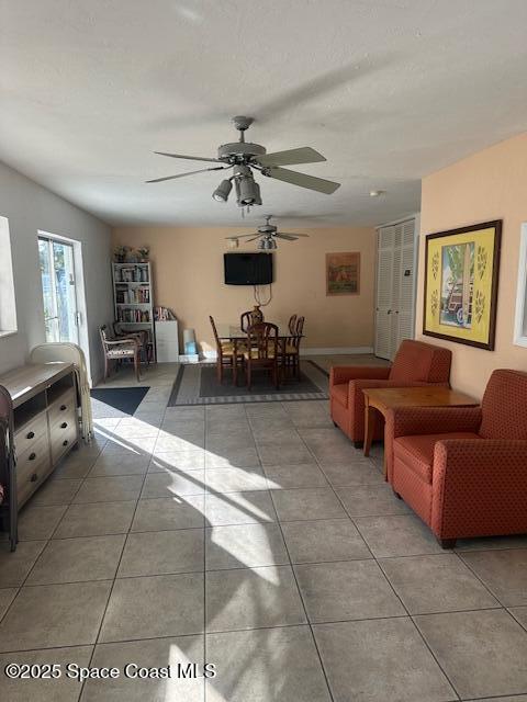 223 Columbia Drive, Unit 114 Cape Canaveral, FL 32920 - Photo 8 of 14 a living room with furniture and a flat screen tv