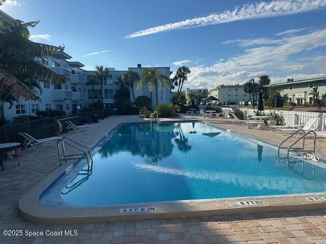 223 Columbia Drive, Unit 114 Cape Canaveral, FL 32920 - Photo 10 of 14 a view of a swimming pool with outdoor seating