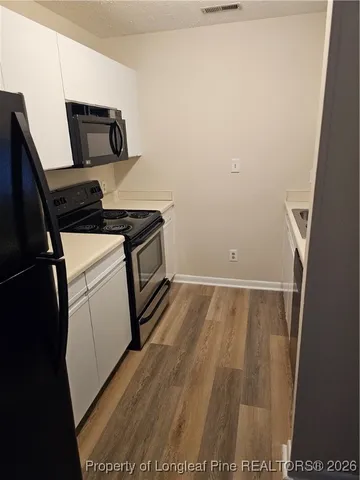 a refrigerator freezer sitting inside of a kitchen
