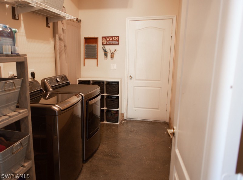 5517 Spanish River Road Fort Pierce, FL 34951 - Photo 12 of 24 a utility room with dryer and washer