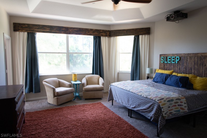5517 Spanish River Road Fort Pierce, FL 34951 - Photo 13 of 24 a bedroom with a bed couch and a window