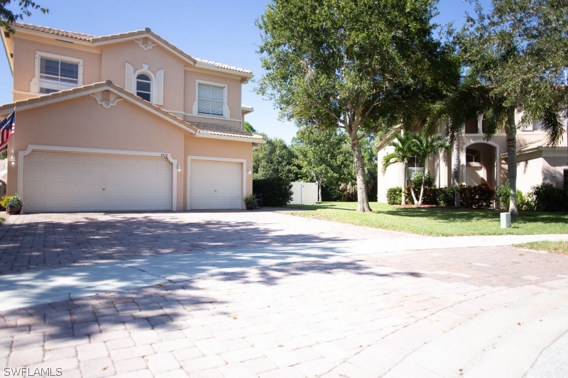 5517 Spanish River Road Fort Pierce, FL 34951 - Photo 2 of 24 a front view of house with yard and green space