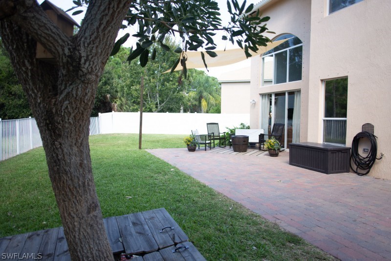 5517 Spanish River Road Fort Pierce, FL 34951 - Photo 22 of 24 a view of backyard with deck and outdoor seating