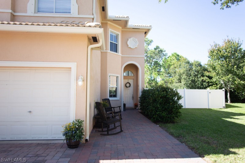 5517 Spanish River Road Fort Pierce, FL 34951 - Photo 3 of 24 a front view of a house with garden