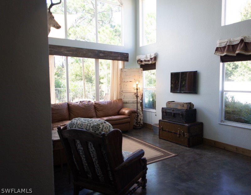 5517 Spanish River Road Fort Pierce, FL 34951 - Photo 5 of 24 a living room with furniture and a flat screen tv