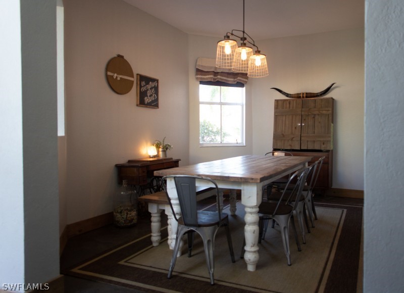 5517 Spanish River Road Fort Pierce, FL 34951 - Photo 6 of 24 a dining room with furniture and window