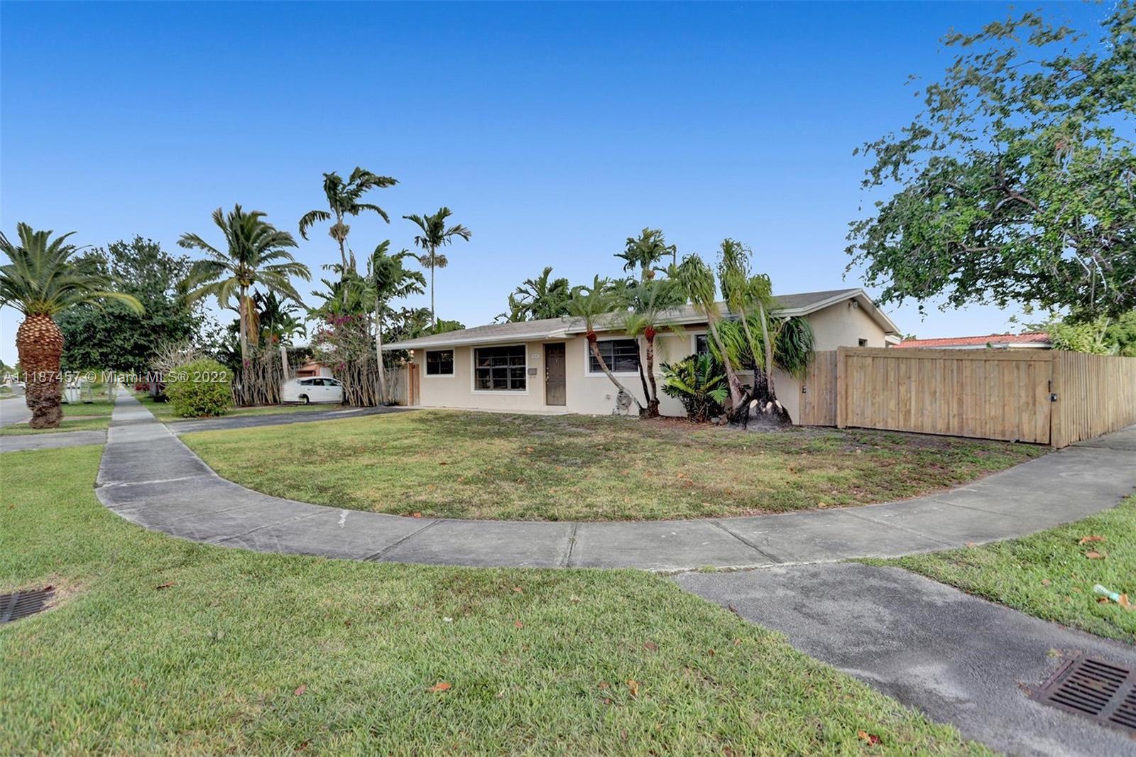 10401 Southwest 53rd Street Miami, FL 33165 - Photo 13 of 53 a view of a house with backyard and a tree