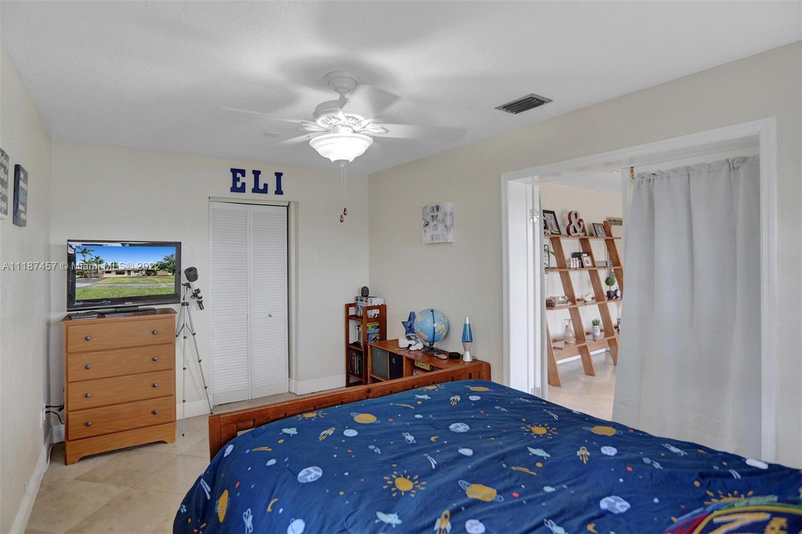 10401 Southwest 53rd Street Miami, FL 33165 - Photo 16 of 53 a bedroom with a bed and furniture