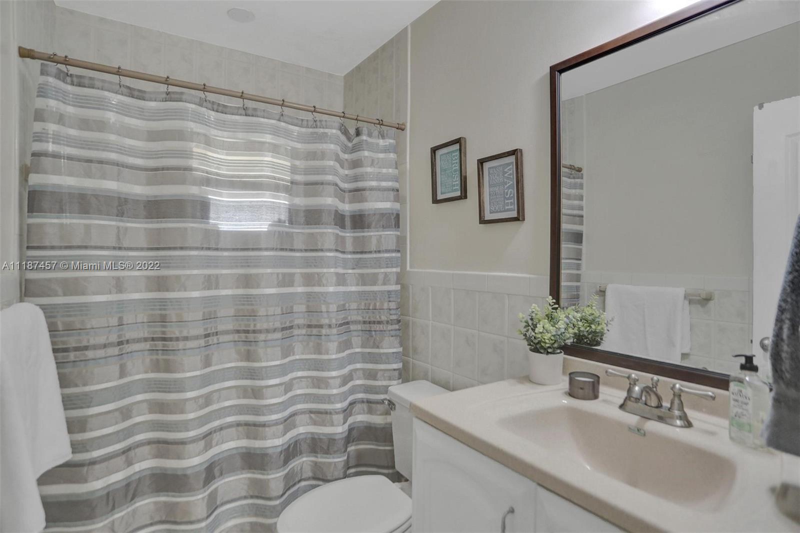 10401 Southwest 53rd Street Miami, FL 33165 - Photo 19 of 53 a bathroom with a sink toilet and shower