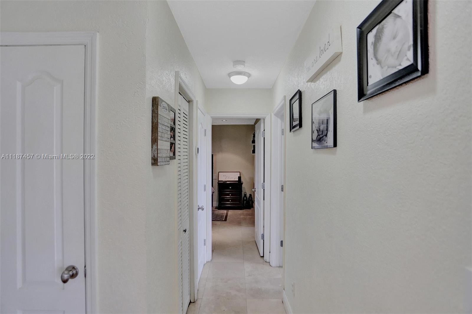 10401 Southwest 53rd Street Miami, FL 33165 - Photo 20 of 53 a view of a hallway with closet