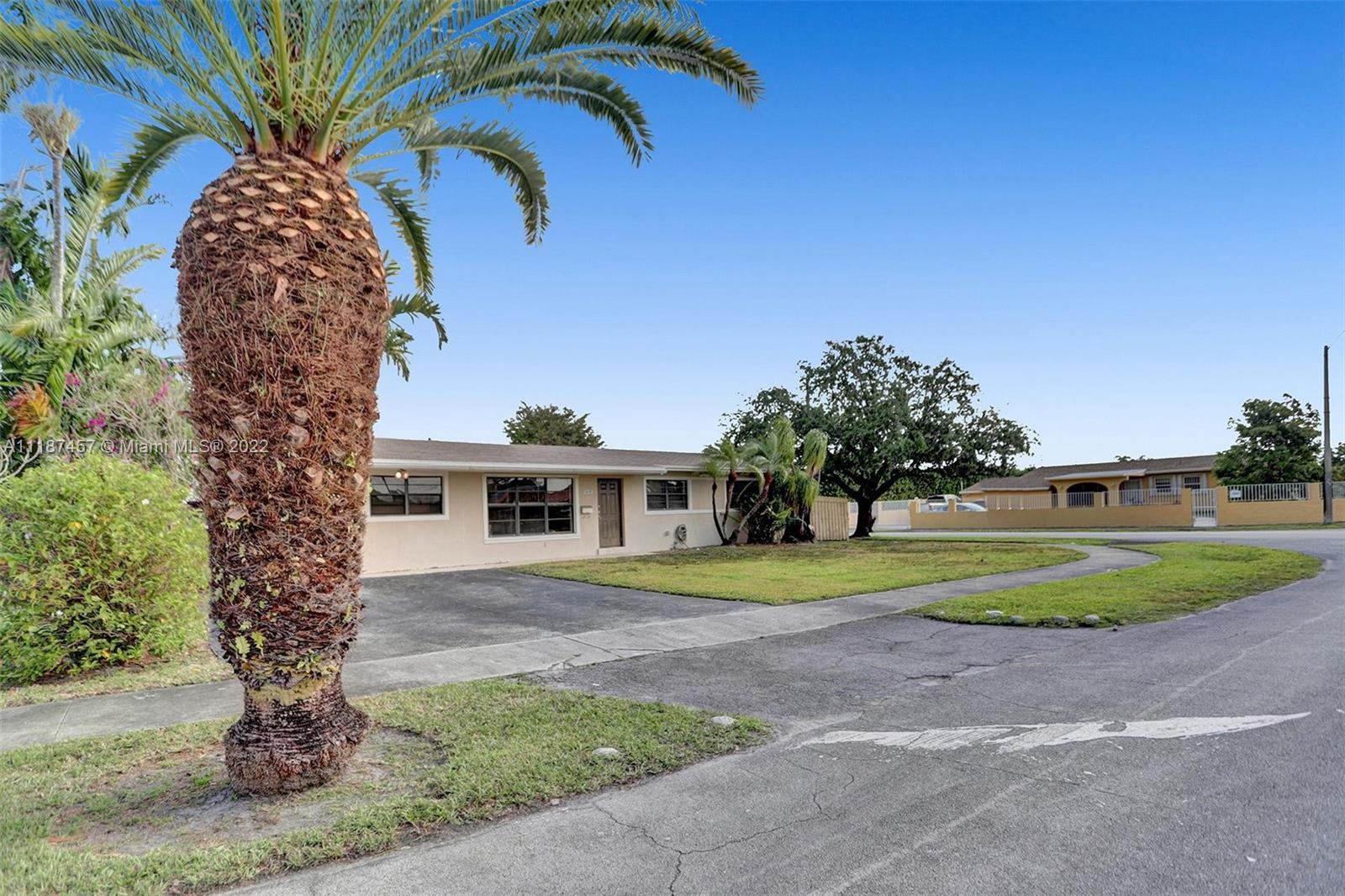 10401 Southwest 53rd Street Miami, FL 33165 - Photo 2 of 53 a front view of a house with a yard