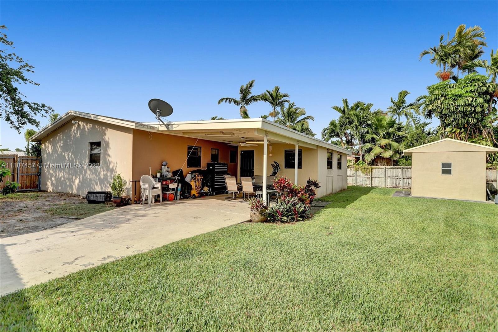 10401 Southwest 53rd Street Miami, FL 33165 - Photo 21 of 53 a view of a house with backyard and sitting area
