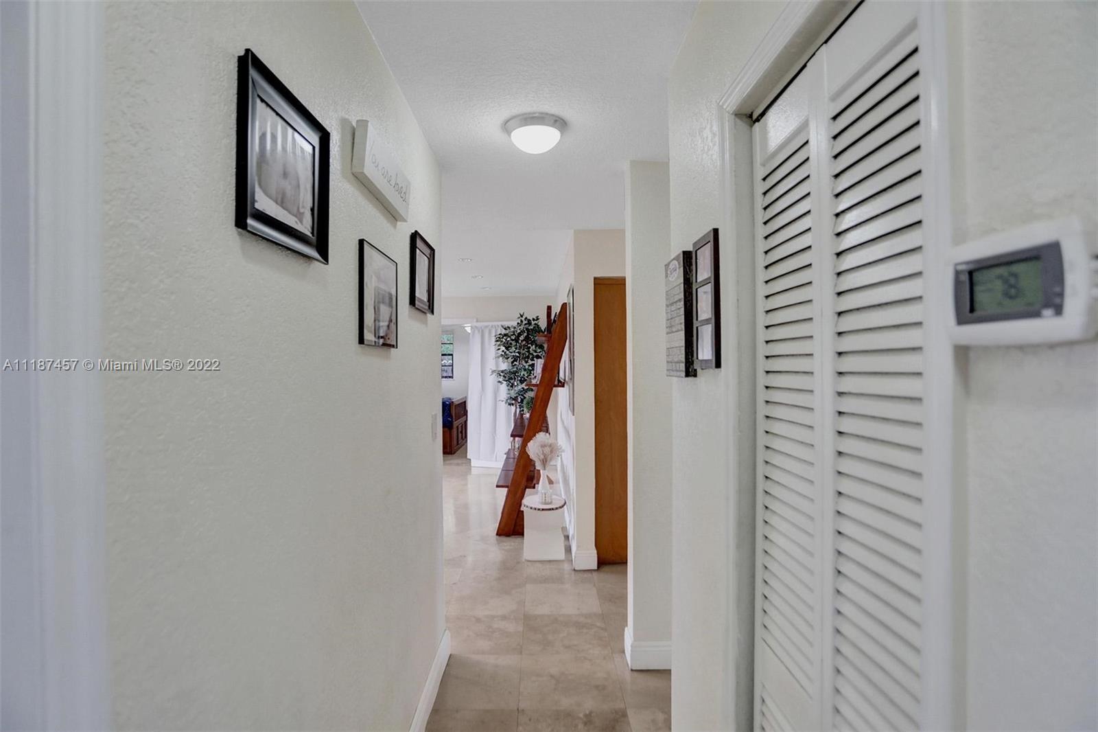 10401 Southwest 53rd Street Miami, FL 33165 - Photo 22 of 53 a view of a hallway to rooms