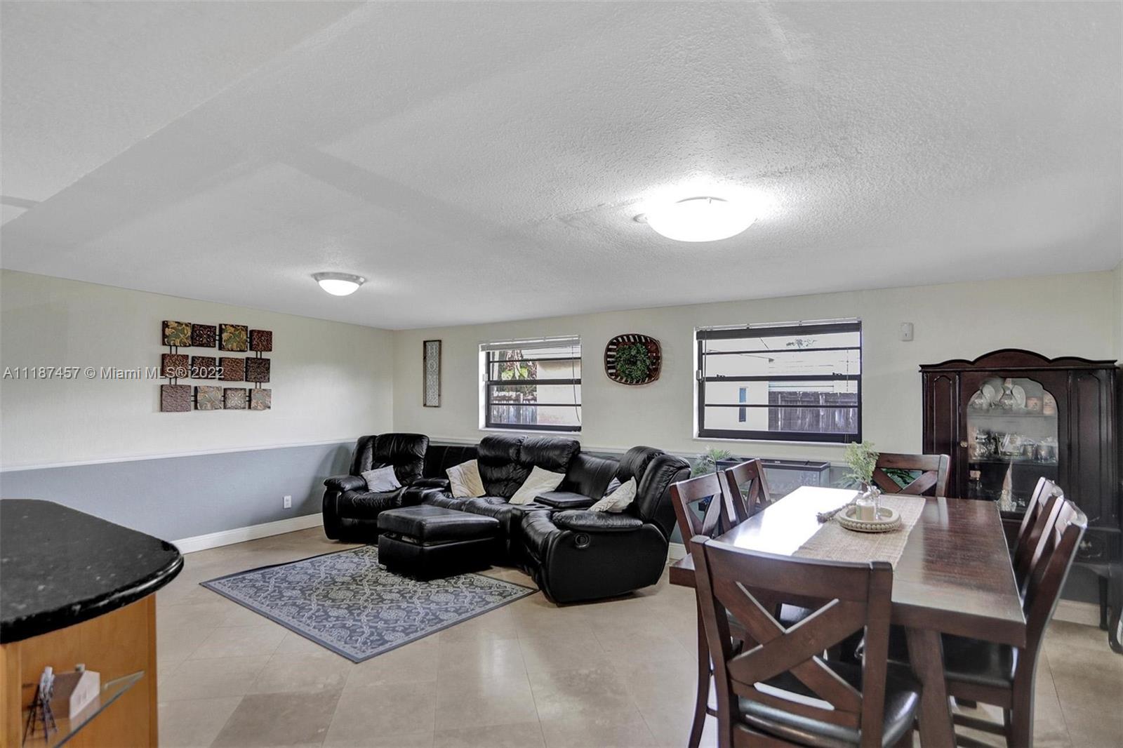 10401 Southwest 53rd Street Miami, FL 33165 - Photo 26 of 53 a living room with furniture a rug and a window
